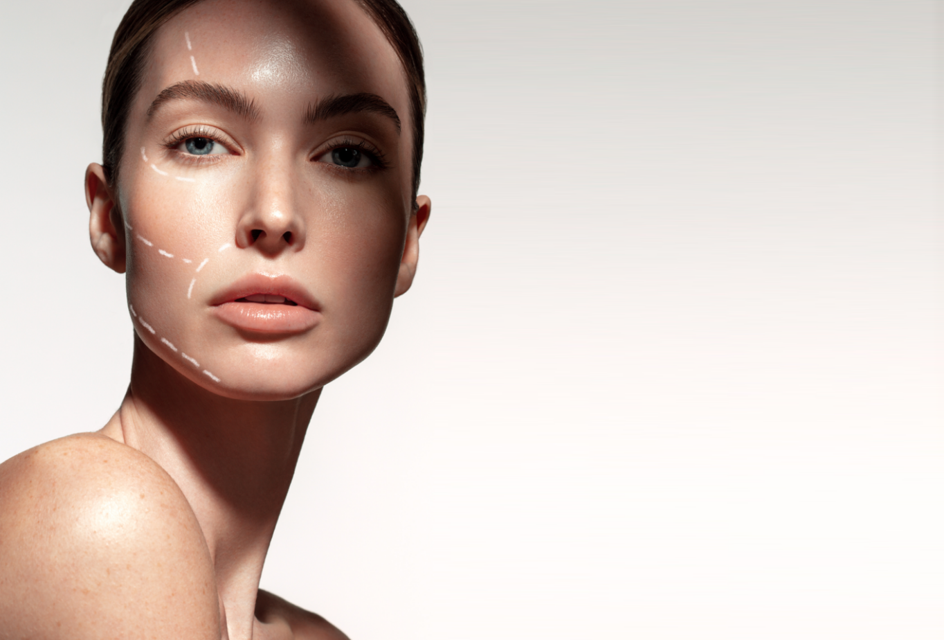 a woman with white lines on the right side of her face