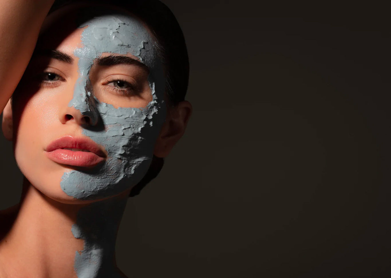 a woman's face with product on one side of it