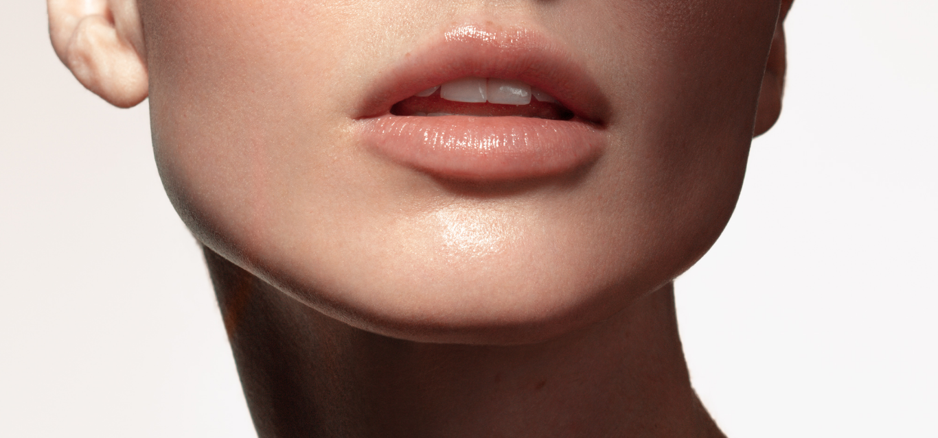 the bottom part of a woman's face showing her lips